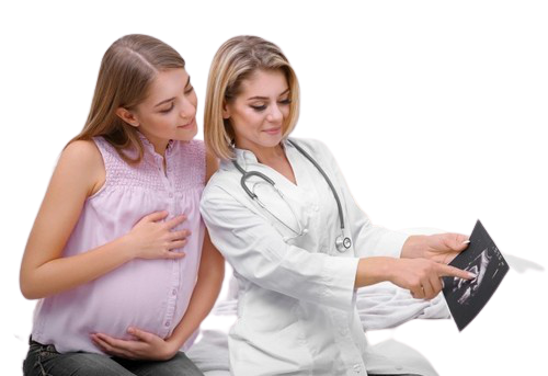 A woman holds a pregnancy chart while a doctor examines it at the Best Gynaecology Hospital in Kota.